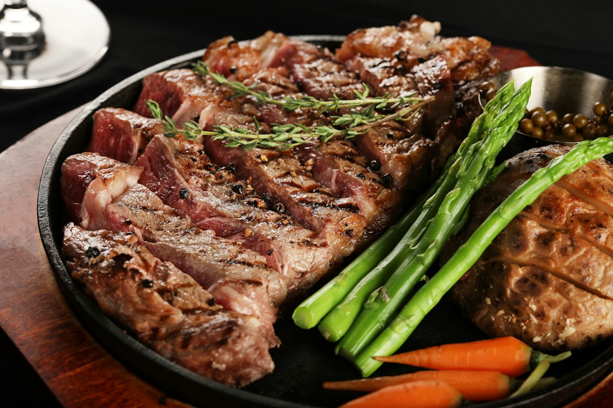 Steak searing on a cast-iron skillet